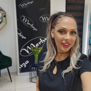 Beatrice, beauty therpaist at Merluza Hair & Beauty in Hall Green, Birmingham – known for her creative flair in hair styling and attention to detail in beauty treatments.