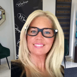 Ela, Creative Director at Merluza Hair & Beauty in Hall Green, Birmingham – specialist in beautiful colour work and professional styling with over 30 years of experience.