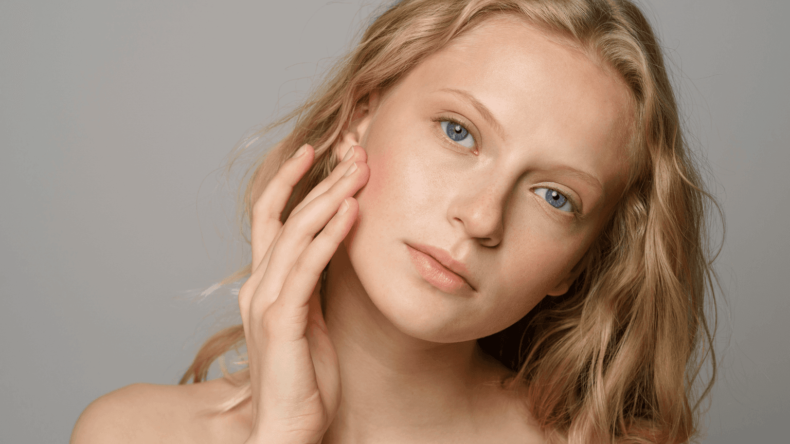 Close-up of woman with clear, glowing skin – representing the results of Skinician facial treatments at Merluza Hair & Beauty in Hall Green, Birmingham.